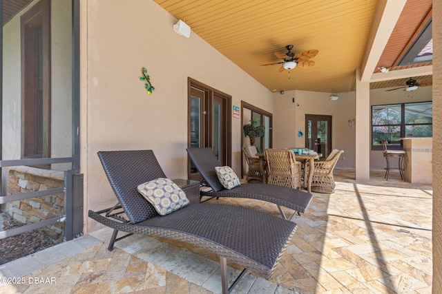 view of patio with ceiling fan and outdoor dining space