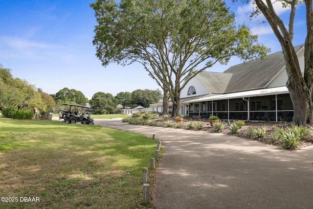 view of property's community with a lawn