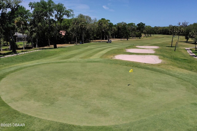 view of property's community featuring view of golf course
