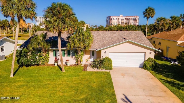 view of front of house with a garage and a front lawn