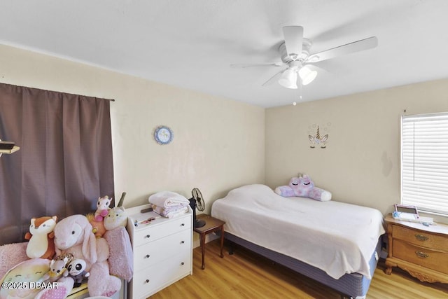 bedroom featuring ceiling fan and light wood-type flooring