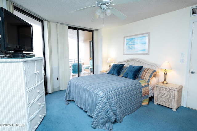 carpeted bedroom with expansive windows, ceiling fan, a textured ceiling, and access to outside