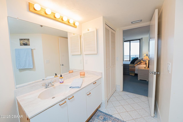 bathroom with vanity and tile patterned floors