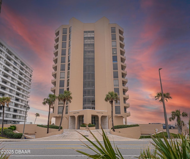 view of outdoor building at dusk