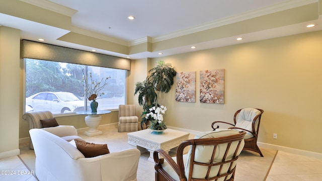 living area with light tile patterned floors and ornamental molding