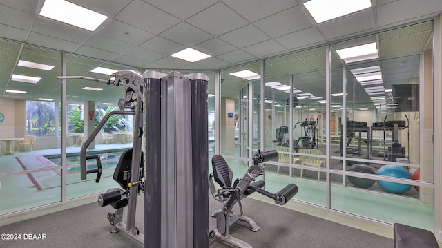 workout area with a drop ceiling