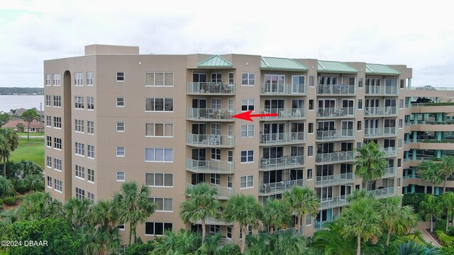 view of building exterior with a water view