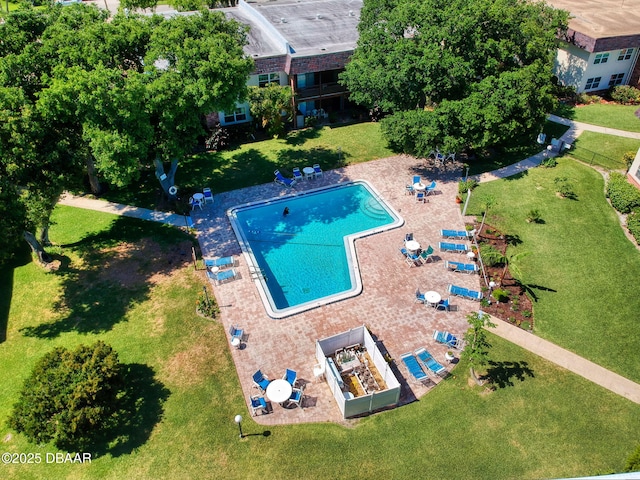 view of swimming pool with a lawn and a patio area