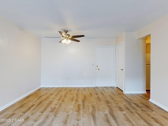 unfurnished room with ceiling fan and light hardwood / wood-style floors