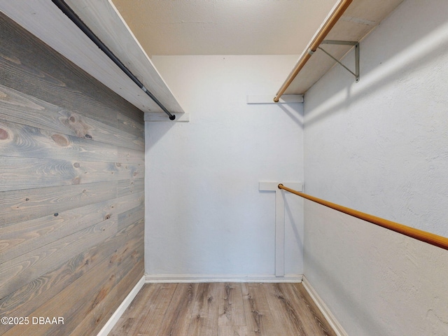 walk in closet featuring hardwood / wood-style floors