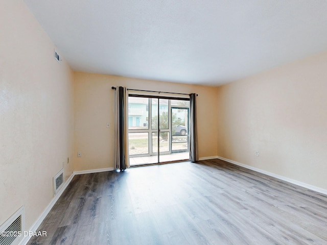 unfurnished room featuring light wood-type flooring