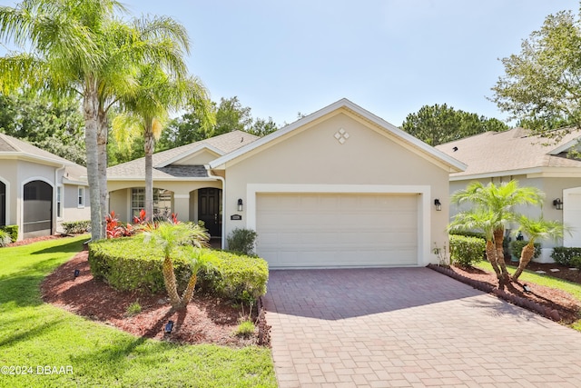 single story home featuring a garage