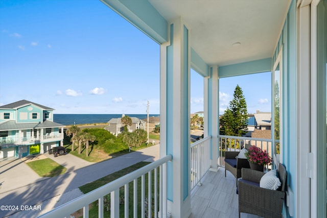 balcony featuring a water view