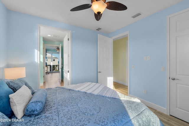 bedroom featuring ceiling fan and light hardwood / wood-style flooring