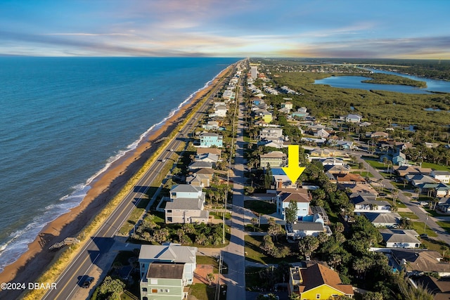 bird's eye view featuring a water view and a view of the beach