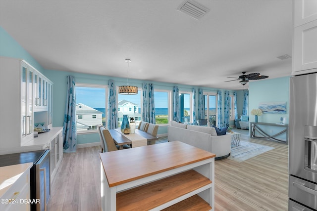 interior space with light hardwood / wood-style floors and ceiling fan