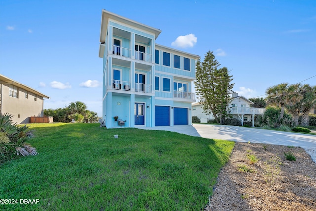 view of front of house featuring a garage, a front lawn, and a balcony