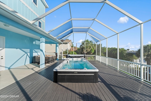 view of pool with a lanai and a deck