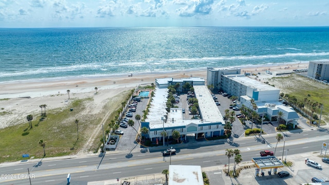 aerial view featuring a water view and a beach view