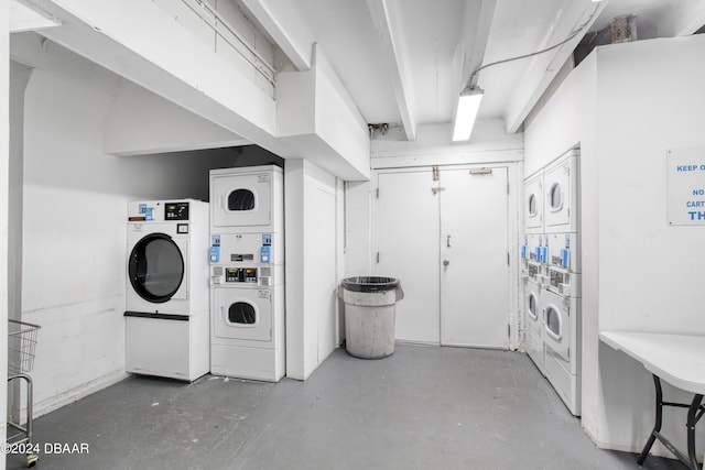 laundry room featuring separate washer and dryer and stacked washer / drying machine