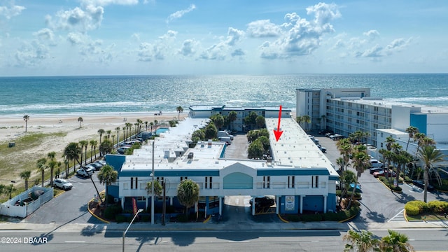 aerial view featuring a water view and a view of the beach