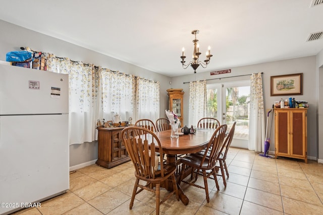 225 Sherwood Ln, Daytona Beach, FL 32117 - dining space with a chandelier and light tile patterned floors