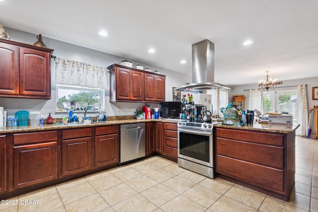 225 Sherwood Ln, Daytona Beach, FL 32117 - kitchen with appliances with stainless steel finishes, island range hood, a peninsula, stone counters, and a chandelier