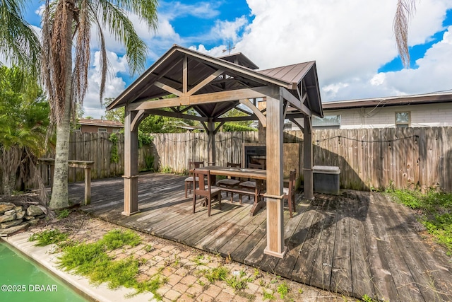 225 Sherwood Ln, Daytona Beach, FL 32117 - wooden terrace featuring a gazebo and a fenced backyard