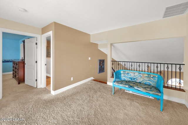 sitting room featuring carpet