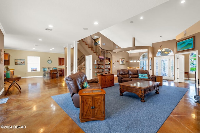 living room featuring concrete floors and vaulted ceiling