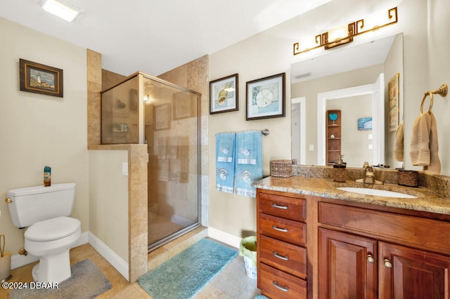 bathroom with tile patterned flooring, vanity, an enclosed shower, and toilet