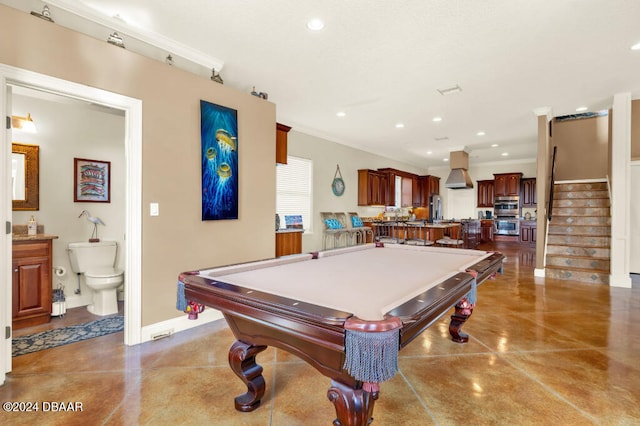 recreation room with ornamental molding, billiards, and concrete floors