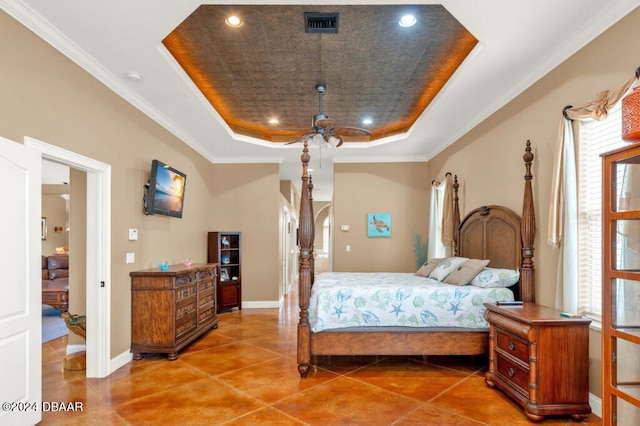 bedroom featuring a raised ceiling, ceiling fan, and crown molding