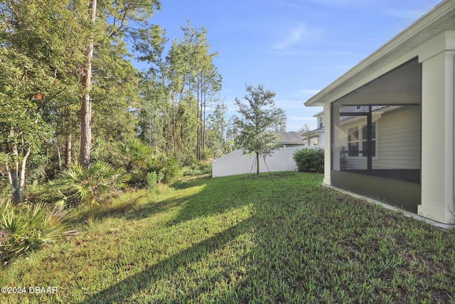 view of yard with a sunroom