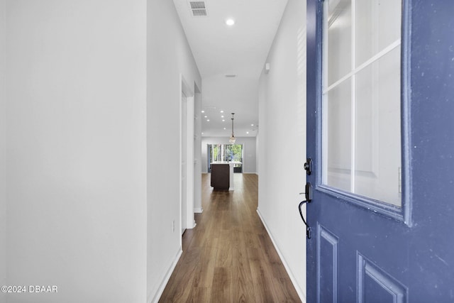 hall with dark hardwood / wood-style floors