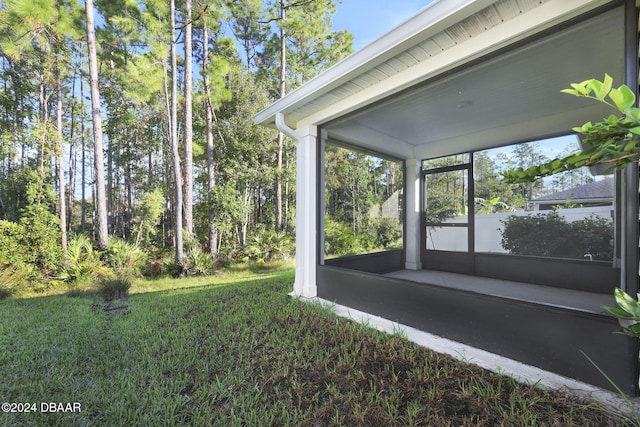 view of yard featuring a sunroom