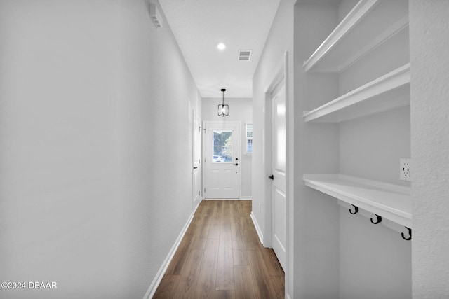 corridor featuring dark hardwood / wood-style flooring