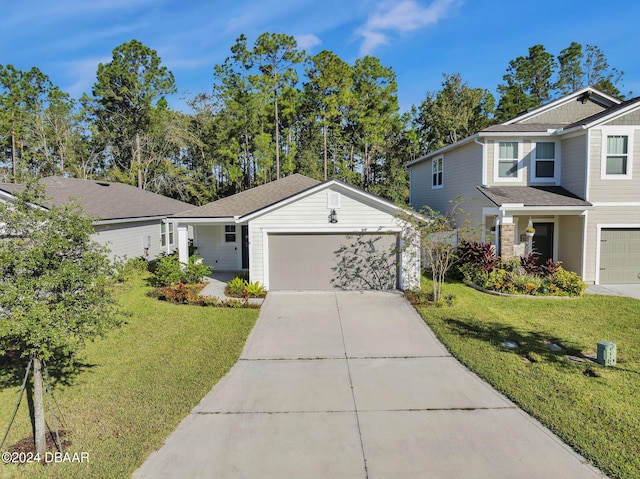 view of front facade featuring a front yard and a garage