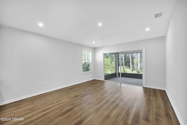 spare room featuring dark hardwood / wood-style flooring