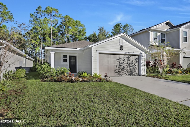 view of front of home with a garage and a front yard