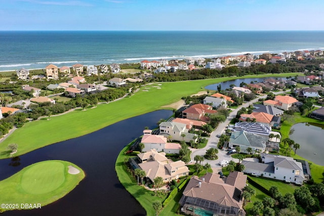 aerial view featuring a residential view and a water view
