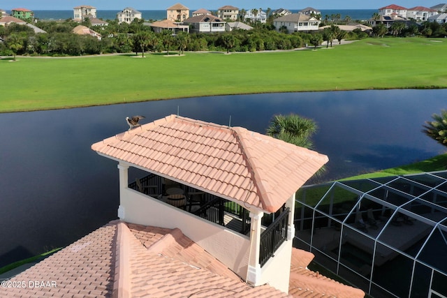 dock area with golf course view and a water view