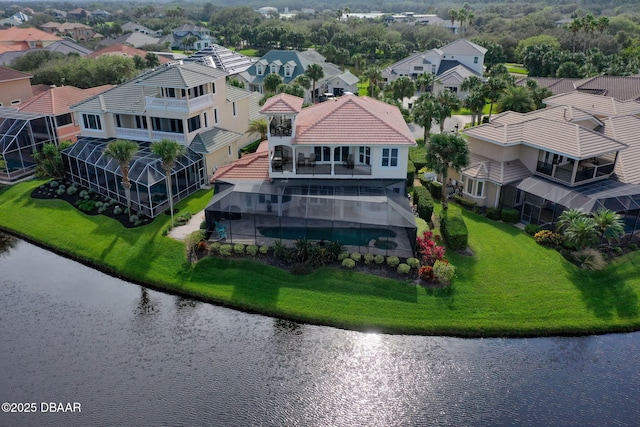 bird's eye view with a water view and a residential view