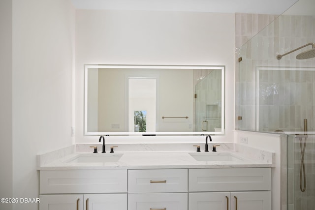 bathroom featuring vanity and an enclosed shower