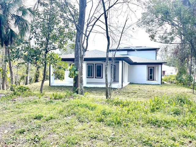 exterior space with a yard and a patio area