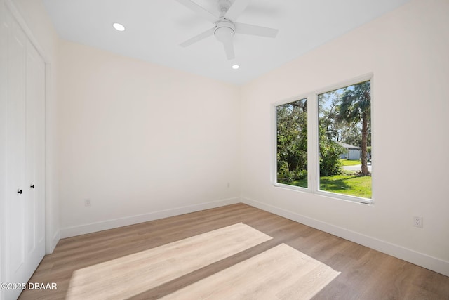 spare room with ceiling fan and light hardwood / wood-style floors