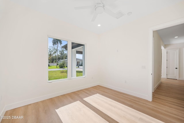 spare room with ceiling fan and light hardwood / wood-style floors