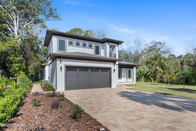 view of front facade with a garage and a front lawn