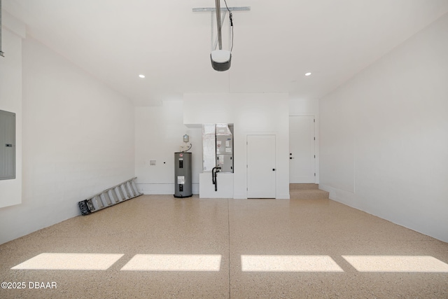 garage featuring water heater, heating unit, and electric panel