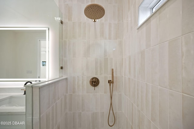 bathroom with a tile shower